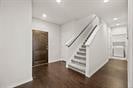 foyer entrance featuring recessed lighting, dark wood finished floors, and baseboards