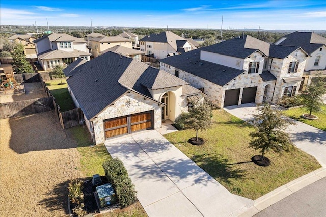 birds eye view of property with a residential view