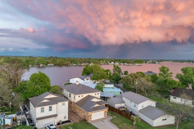 aerial view with a water view and a residential view