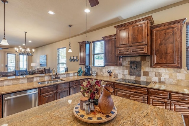 kitchen featuring black electric stovetop, stainless steel dishwasher, a sink, and tasteful backsplash