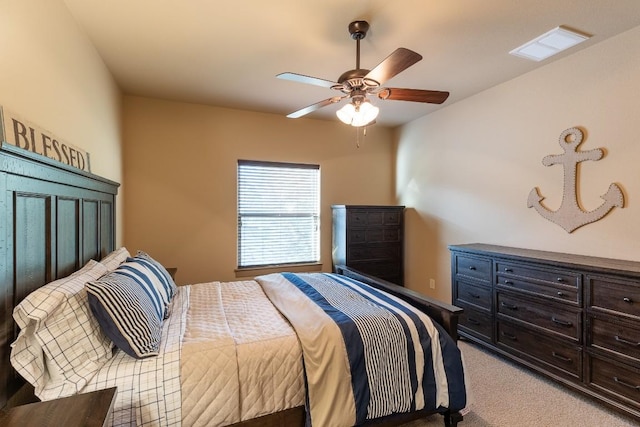 bedroom featuring a ceiling fan, light carpet, and visible vents