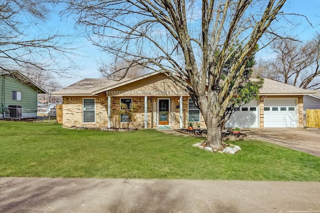 view of front of property with an attached garage, central AC, brick siding, fence, and a front yard