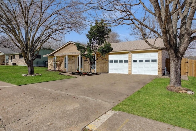 single story home with brick siding, an attached garage, fence, driveway, and a front lawn