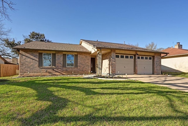 ranch-style home featuring concrete driveway, brick siding, an attached garage, and a front yard