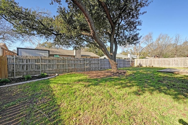 view of yard featuring a fenced backyard