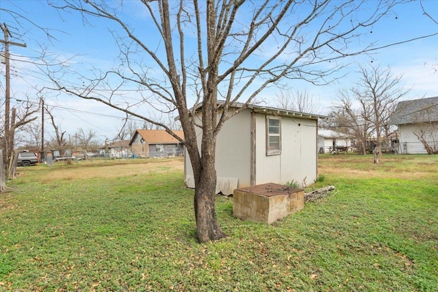 view of yard with a shed and an outbuilding