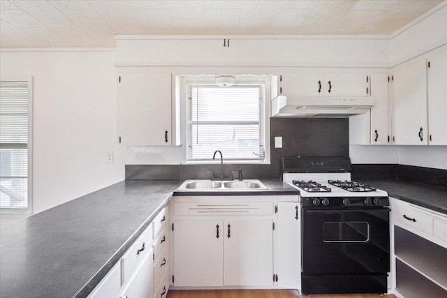 kitchen with gas stove, a sink, white cabinetry, and under cabinet range hood