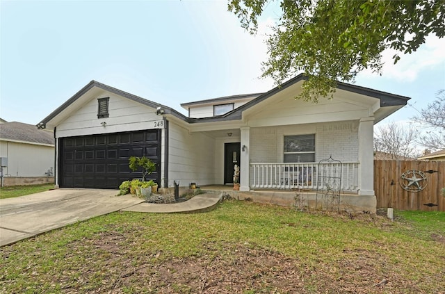 view of front of house with a porch, a garage, brick siding, driveway, and a front yard