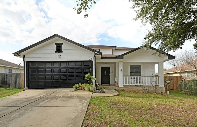 ranch-style house with covered porch, concrete driveway, brick siding, and fence