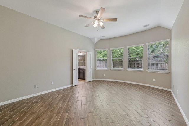 2629 Estefania Ln, Round Rock, TX 78665 - empty room featuring lofted ceiling, a ceiling fan, wood finished floors, and baseboards
