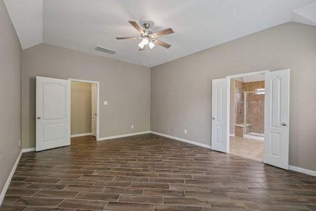 2629 Estefania Ln, Round Rock, TX 78665 - unfurnished bedroom with lofted ceiling, ensuite bathroom, baseboards, dark wood-style flooring, and ceiling fan