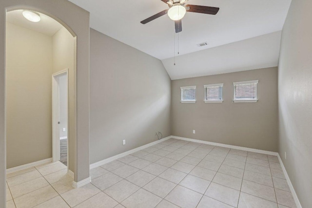2629 Estefania Ln, Round Rock, TX 78665 - spare room with ceiling fan, light tile patterned floors, vaulted ceiling, baseboards, and arched walkways
