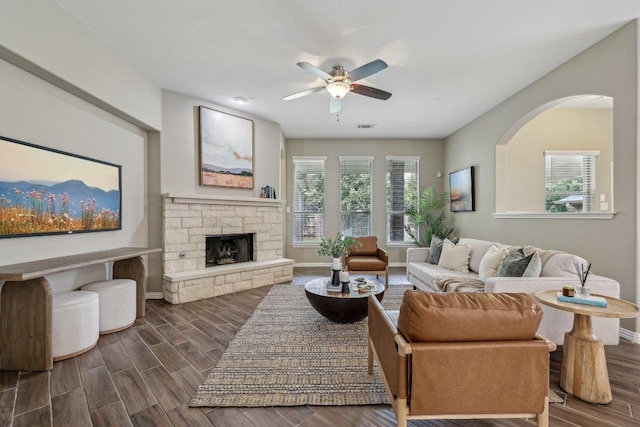 2629 Estefania Ln, Round Rock, TX 78665 - living room featuring plenty of natural light, a ceiling fan, baseboards, and dark wood-style flooring
