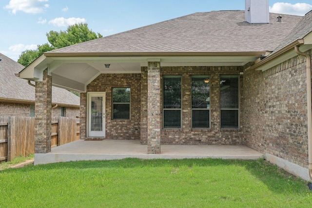 2629 Estefania Ln, Round Rock, TX 78665 - rear view of property featuring a patio, brick siding, and a shingled roof