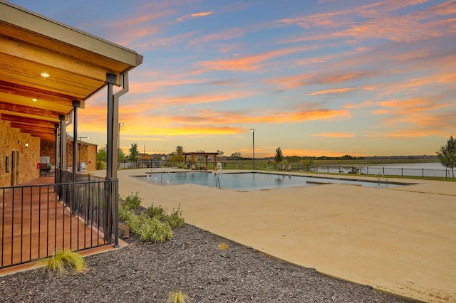 2629 Estefania Ln, Round Rock, TX 78665 - pool at dusk featuring a patio area and a water view