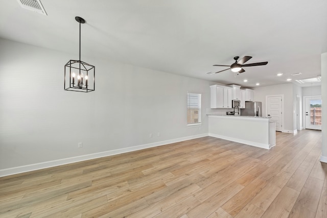 unfurnished living room with recessed lighting, a ceiling fan, baseboards, visible vents, and light wood-style floors