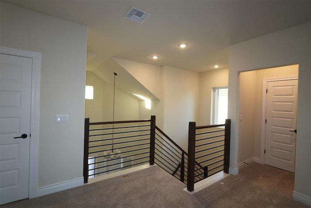 staircase with carpet flooring, recessed lighting, visible vents, and baseboards