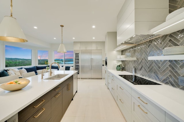 kitchen with light countertops, appliances with stainless steel finishes, and a sink