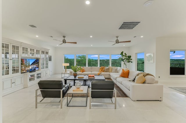 living room with recessed lighting and visible vents