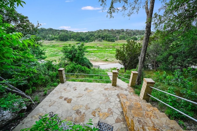 view of patio featuring a wooded view