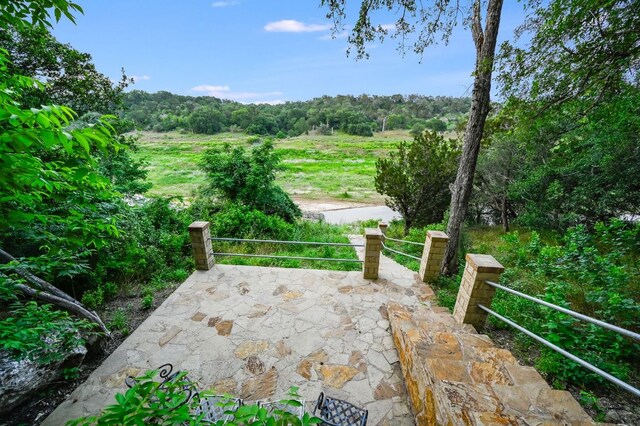 24710 Fossil Trl, Spicewood, TX 78669 - view of patio with a view of trees