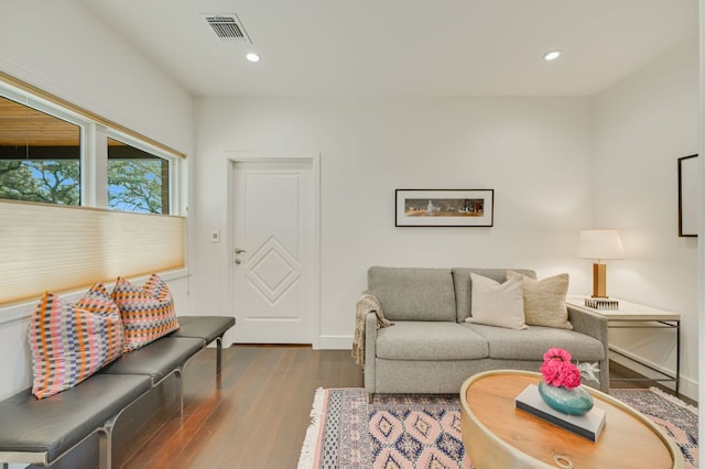 living room featuring recessed lighting, visible vents, baseboards, and dark wood-style floors