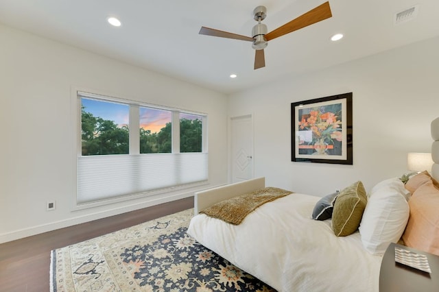 bedroom with visible vents, a ceiling fan, wood finished floors, recessed lighting, and baseboards