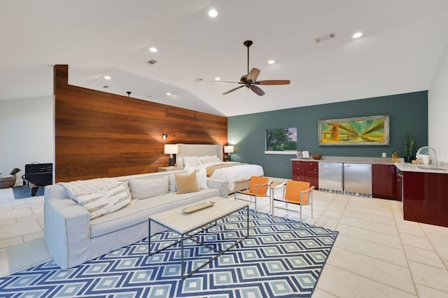 tiled living area featuring wooden walls, recessed lighting, lofted ceiling, and visible vents