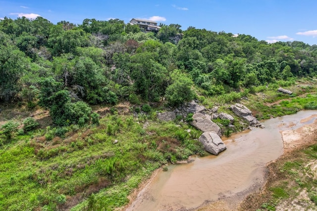 aerial view featuring a wooded view