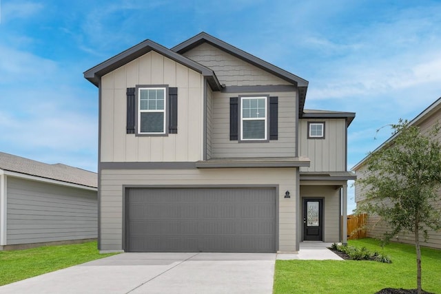 view of front of house with a garage, board and batten siding, and fence