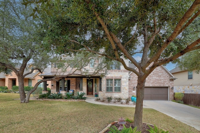 view of front of house with driveway, brick siding, an attached garage, and a front yard