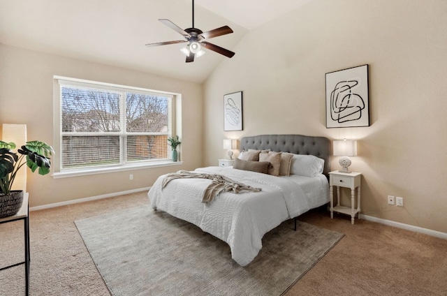 carpeted bedroom with a ceiling fan, vaulted ceiling, and baseboards