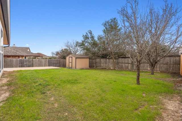 view of yard featuring a fenced backyard, an outdoor structure, a patio, and a storage unit