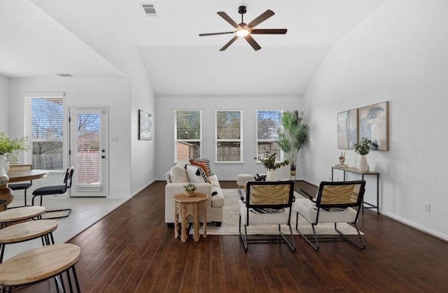 sitting room featuring visible vents, vaulted ceiling, and wood finished floors