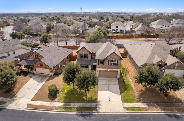 birds eye view of property with a residential view