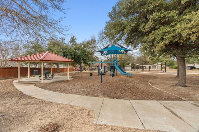 communal playground with a gazebo and fence