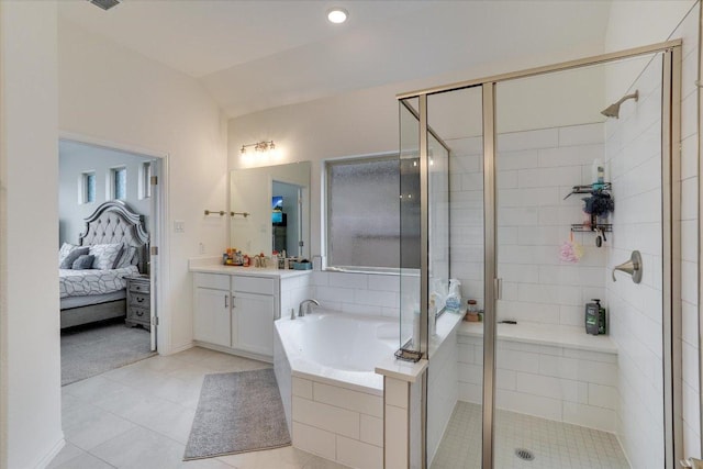 ensuite bathroom with ensuite bath, a garden tub, vaulted ceiling, vanity, and a shower stall