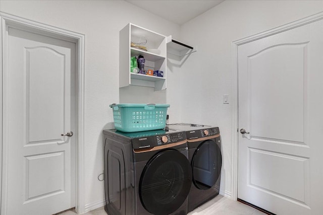 washroom with laundry area and independent washer and dryer