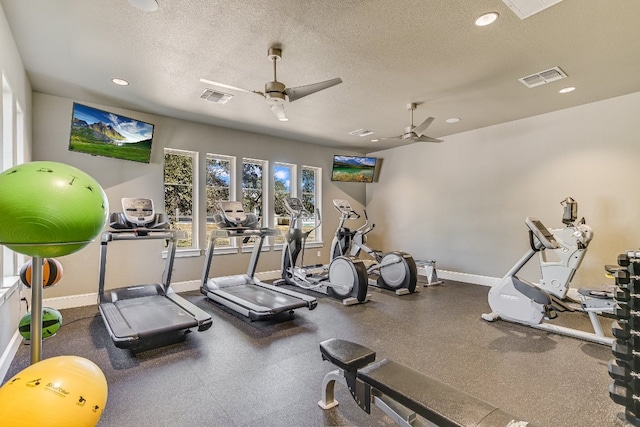 workout area with baseboards, visible vents, a textured ceiling, and recessed lighting