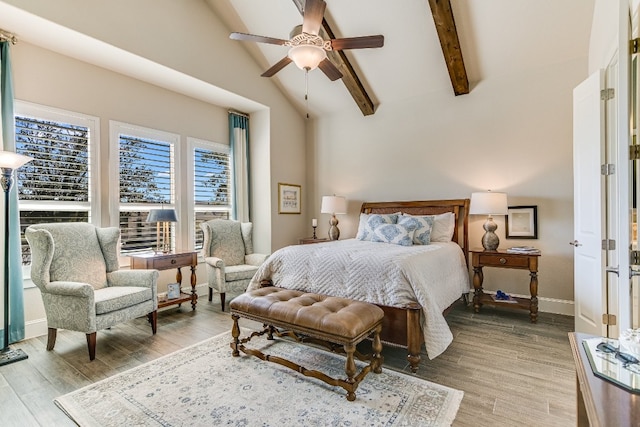 bedroom featuring vaulted ceiling with beams, baseboards, a ceiling fan, and wood finished floors