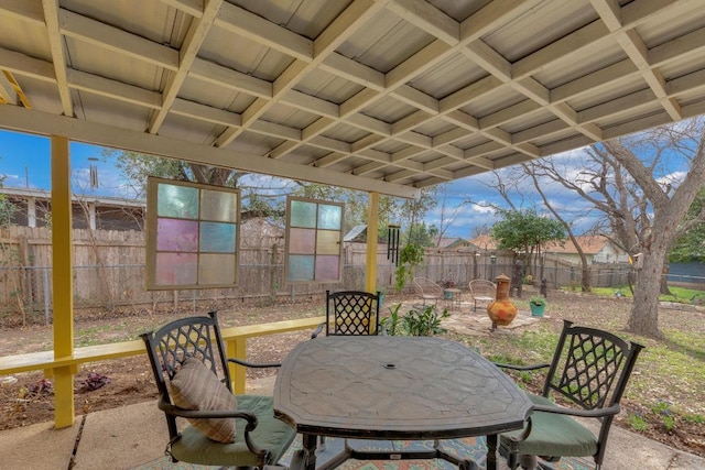 view of patio with outdoor dining area and a fenced backyard