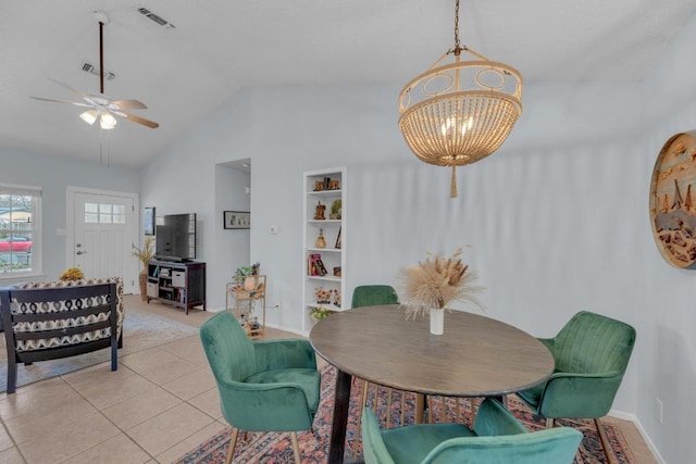 dining room featuring vaulted ceiling, light tile patterned flooring, visible vents, and built in features