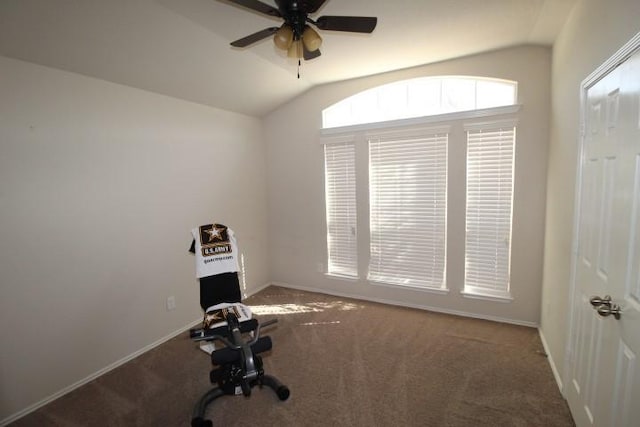 workout room featuring a ceiling fan, carpet flooring, vaulted ceiling, and baseboards