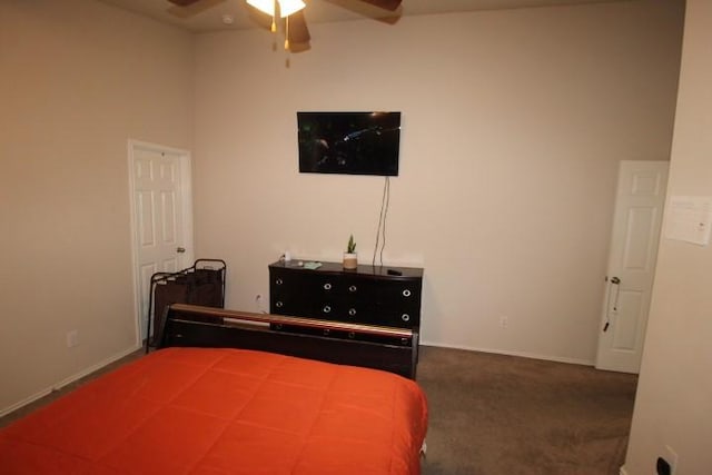 carpeted bedroom with baseboards and a ceiling fan