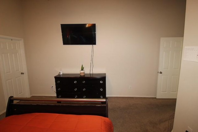 bedroom featuring carpet floors and baseboards