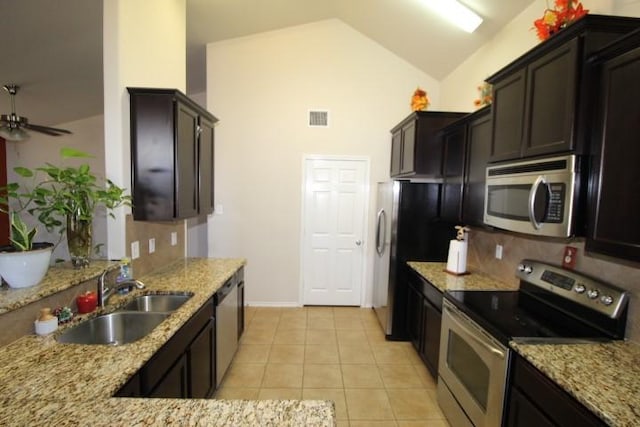 kitchen with light tile patterned floors, visible vents, decorative backsplash, stainless steel appliances, and a sink