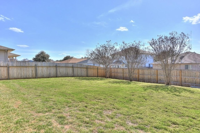 view of yard featuring a fenced backyard