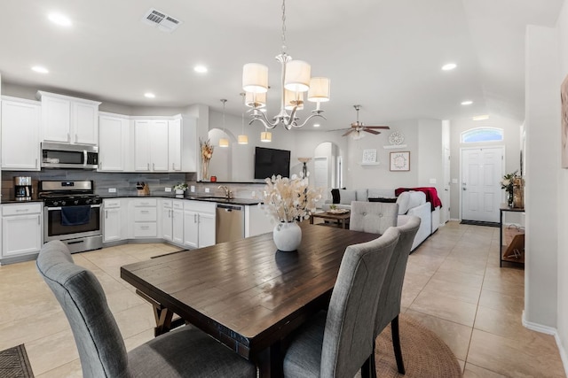 258 Noddy Rd, Buda, TX 78610 - dining space featuring a chandelier, arched walkways, light tile patterned floors, recessed lighting, and ceiling fan