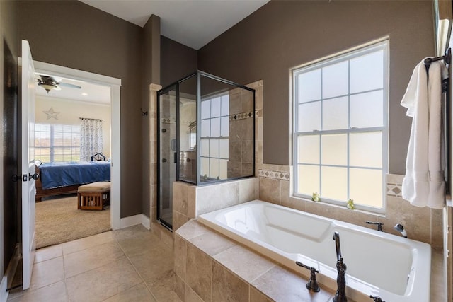 ensuite bathroom with a stall shower, tile patterned floors, ensuite bath, and a garden tub