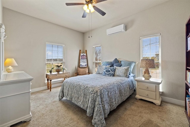 bedroom featuring baseboards, multiple windows, an AC wall unit, and light carpet